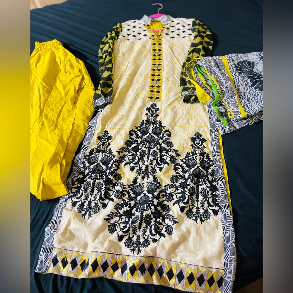 yellow embroidered pakistani suit